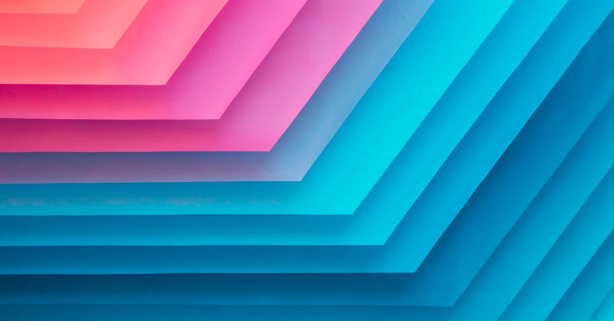 Colorful abstract geometric pattern with layers of pink and blue for vibrant backgrounds.