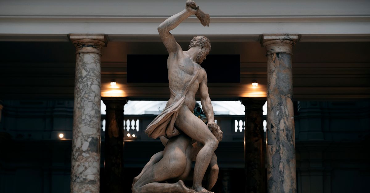 Samson Slaying a Philistine sculpture in the V&A, London, with dramatic lighting.