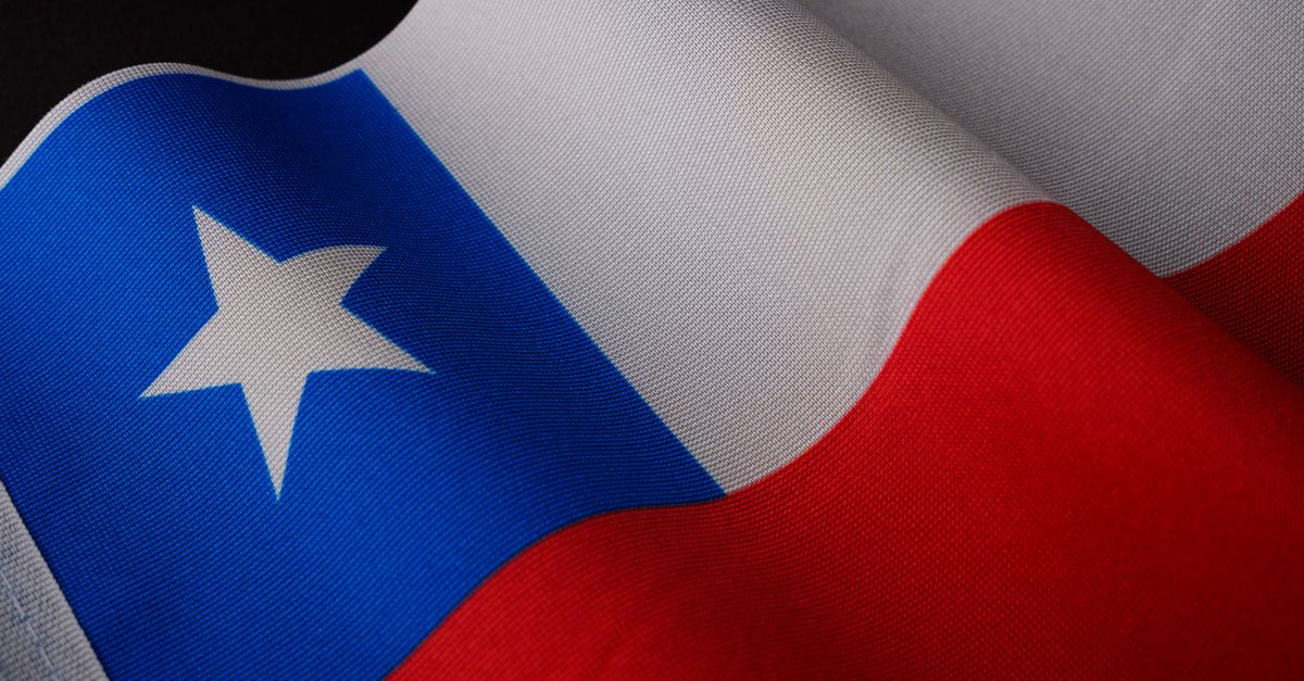 Detailed close-up of the Chilean national flag with vibrant colors and texture.
