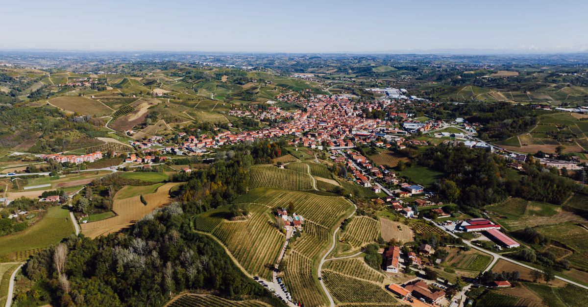 A stunning aerial view of Canale, Piedmont, highlighting its vineyards and rolling hills.