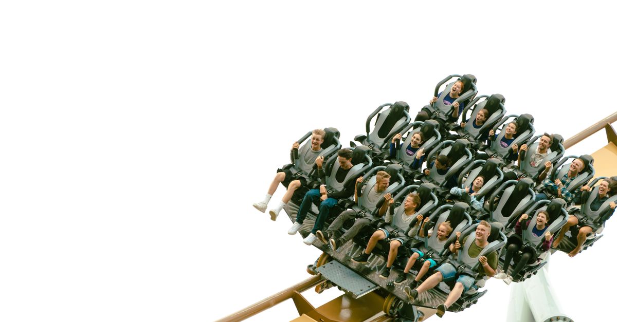 Excited group enjoying a thrilling roller coaster at Liseberg Amusement Park in Sweden.