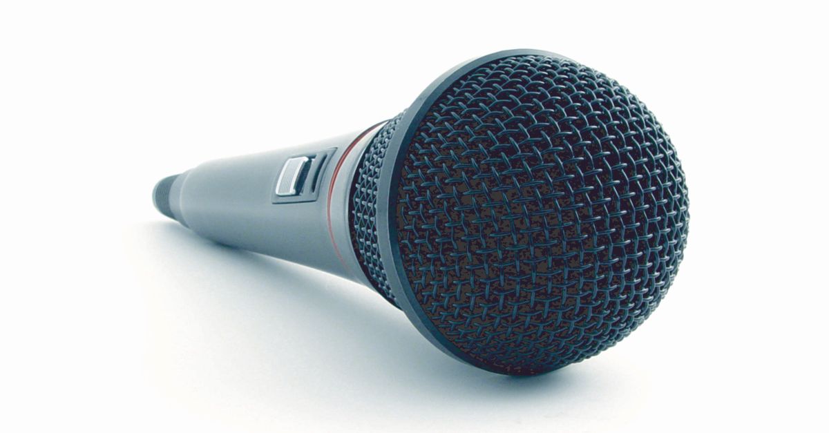 Close-up of a condenser microphone illustrating sound recording equipment in a studio setting.