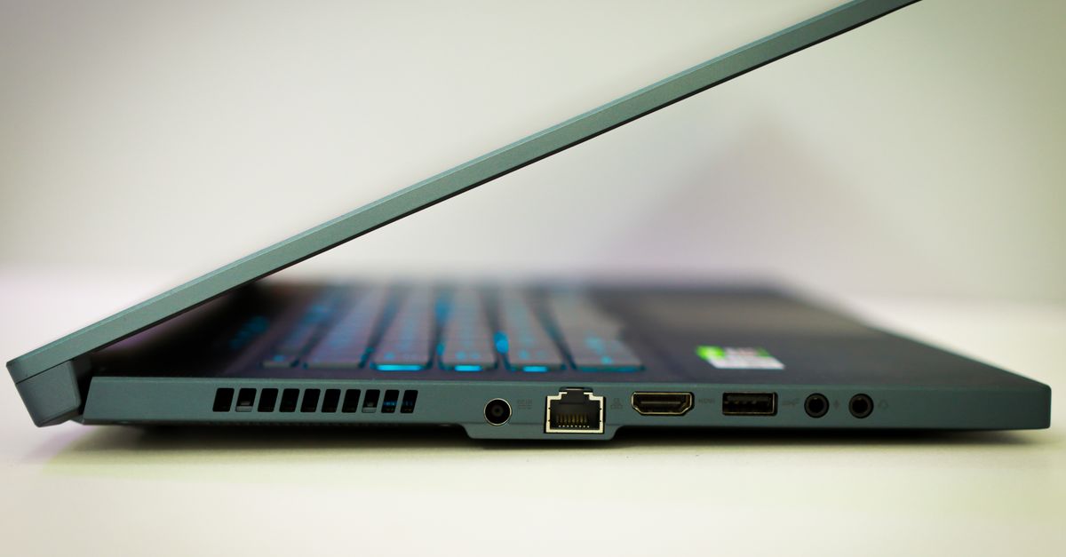 Close-up of a sleek laptop featuring various ports and a slim design.