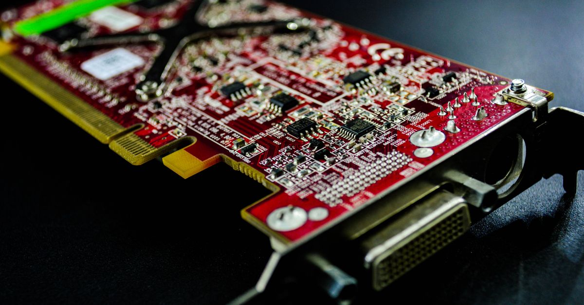 Detailed close-up of a red circuit board highlighting electronic components and connectors.