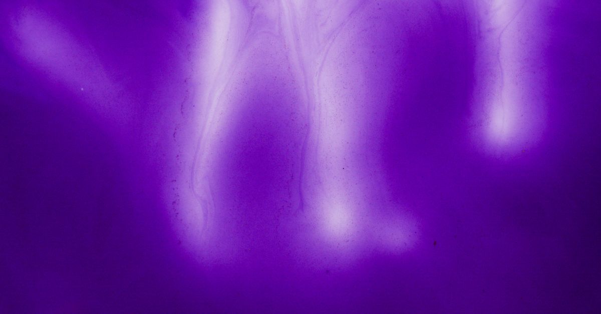 A visually striking abstract background in vivid purple tones with flowing patterns.